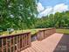 Back deck of a beautiful lawn including a playground and shed in the background at 11850 Sugar Hill Rd, Davidson, NC 28036