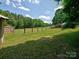 Large backyard featuring a shed, target, and a healthy green lawn at 11850 Sugar Hill Rd, Davidson, NC 28036