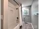 Clean bathroom with a tub, white subway tile, shower, and modern hardware at 11850 Sugar Hill Rd, Davidson, NC 28036