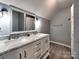 Stylish bathroom with dual sinks, marble countertop, and modern fixtures at 11850 Sugar Hill Rd, Davidson, NC 28036