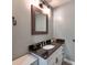 Bathroom with granite countertop, updated vanity, and modern fixtures at 11850 Sugar Hill Rd, Davidson, NC 28036