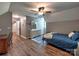 Bedroom featuring hardwood floors, gray walls, a white dresser and a bed with blue comforter at 11850 Sugar Hill Rd, Davidson, NC 28036