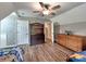Bright bedroom with hardwood floors, ceiling fan, and furniture at 11850 Sugar Hill Rd, Davidson, NC 28036