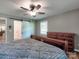 Bedroom with hard wood floors, dresser, and sliding barn door at 11850 Sugar Hill Rd, Davidson, NC 28036