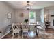 Charming dining room featuring wood table, stylish chairs, and a decorative light fixture at 11850 Sugar Hill Rd, Davidson, NC 28036