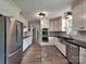 Spacious kitchen featuring stainless steel appliances, ample cabinets, and hardwood floors at 11850 Sugar Hill Rd, Davidson, NC 28036