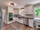 Modern kitchen with stainless steel appliances, sleek countertops, and abundant cabinet space at 11850 Sugar Hill Rd, Davidson, NC 28036