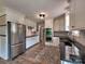 Well-equipped kitchen featuring stainless steel appliances, ample cabinets, and hardwood floors at 11850 Sugar Hill Rd, Davidson, NC 28036
