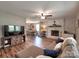 Open-concept living area with fireplace, dining room and comfortable seating at 11850 Sugar Hill Rd, Davidson, NC 28036