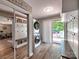 Functional mud room featuring a washer, dryer, coat rack, and sliding door to the backyard at 11850 Sugar Hill Rd, Davidson, NC 28036