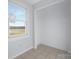 Bright room featuring a window with nature views at 12491 Oak Grove Rd, Stanley, NC 28163