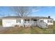 Charming one story home with a covered porch and an attached garage at 12491 Oak Grove Rd, Stanley, NC 28163
