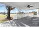 Covered front porch featuring grey flooring, white rails and beautiful views at 12491 Oak Grove Rd, Stanley, NC 28163