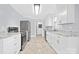 Renovated kitchen featuring stainless steel appliances and granite countertops at 12491 Oak Grove Rd, Stanley, NC 28163