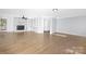 Spacious living room featuring a fireplace, built-ins, and hardwood floors at 12491 Oak Grove Rd, Stanley, NC 28163