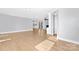 An open living room with hardwood floors and plenty of space for entertaining at 12491 Oak Grove Rd, Stanley, NC 28163