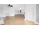 Bright living room with hardwood floors and built-in shelving at 12491 Oak Grove Rd, Stanley, NC 28163