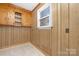 Cozy room with knotty pine wall paneling and wood cabinets at 12491 Oak Grove Rd, Stanley, NC 28163