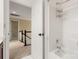 Bathroom view shows the hallway, a sink cabinet, and a tub and shower combo at 12824 Harvest Time Ct, Charlotte, NC 28278