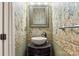 Elegant half bathroom featuring a unique vessel sink and stylish wallpaper at 12824 Harvest Time Ct, Charlotte, NC 28278