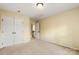 Bedroom features a double door closet, neutral carpet and a view to the staircase at 12824 Harvest Time Ct, Charlotte, NC 28278