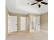 Bedroom with neutral carpet, ceiling fan, and closet access at 12824 Harvest Time Ct, Charlotte, NC 28278