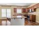 Well-equipped kitchen with stainless steel appliances, an island, and hardwood floors at 12824 Harvest Time Ct, Charlotte, NC 28278