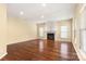 Spacious living room with hardwood floors, fireplace, and abundant natural light at 12824 Harvest Time Ct, Charlotte, NC 28278