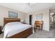 Cozy bedroom features a wooden bed frame, neutral colors, and a vintage writing desk at 13107 Heath Grove Dr, Huntersville, NC 28078