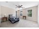 Bright bedroom with large windows, ceiling fan, and a cozy bed, perfect for relaxation at 13107 Heath Grove Dr, Huntersville, NC 28078