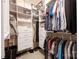 Organized walk-in closet with shelving, drawers, and hanging space for clothes and accessories at 13107 Heath Grove Dr, Huntersville, NC 28078