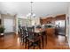 Charming dining area featuring a large table for Gathering gatherings, with an open view to the kitchen and living areas at 13107 Heath Grove Dr, Huntersville, NC 28078