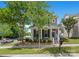Attractive two-story home with a cozy front porch, complemented by lush greenery and a well-maintained lawn at 13107 Heath Grove Dr, Huntersville, NC 28078