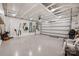 Bright, spacious garage with sealed floors and tool storage, offering ample space for vehicles and projects at 13107 Heath Grove Dr, Huntersville, NC 28078