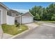 Detached single car garage in a well-maintained suburban neighborhood at 13107 Heath Grove Dr, Huntersville, NC 28078