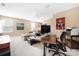 Upstairs living room with a ceiling fan, tv, desk, comfortable seating and neutral carpeting at 13107 Heath Grove Dr, Huntersville, NC 28078