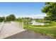 Pond view featuring a walking path, bridge, fountain, and lush greenery at 13107 Heath Grove Dr, Huntersville, NC 28078