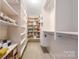 Organized walk-in closet with custom shelving, drawers, and ample storage space at 13107 Heath Grove Dr, Huntersville, NC 28078