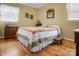 Cozy bedroom featuring hardwood floors and a charming quilted bedspread, creating a warm atmosphere at 1609 Troy Rd, Shelby, NC 28150