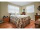 Comfortable bedroom with hardwood floors and natural light from two windows at 1609 Troy Rd, Shelby, NC 28150