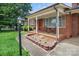 Inviting front porch with seating and a landscaped flower bed, adding curb appeal at 1609 Troy Rd, Shelby, NC 28150
