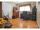 Home office with hardwood floors, ample desk space, and natural lighting at 1609 Troy Rd, Shelby, NC 28150