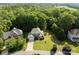 Beautiful aerial view of a home surrounded by lush greenery and towering mature trees at 161 Dairy Farm Rd, Mooresville, NC 28115