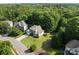 Picturesque aerial view of a home nestled among lush greenery and mature trees at 161 Dairy Farm Rd, Mooresville, NC 28115