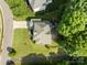 Bird's-eye view of a well-maintained property boasting a patio and surrounded by mature trees at 161 Dairy Farm Rd, Mooresville, NC 28115