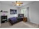 Bedroom with neutral carpet, ceiling fan, and natural light at 161 Dairy Farm Rd, Mooresville, NC 28115