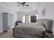 Spacious primary bedroom with a tray ceiling, sitting area and ample natural light from surrounding windows at 161 Dairy Farm Rd, Mooresville, NC 28115