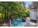 Enjoy outdoor living on this deck, featuring charming turquoise furniture at 161 Dairy Farm Rd, Mooresville, NC 28115