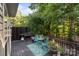 Enjoy outdoor living on this deck, featuring charming turquoise furniture and a Blackstone grill at 161 Dairy Farm Rd, Mooresville, NC 28115