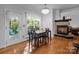 Bright dining area features hardwood floors, fireplace and natural light from door to deck at 161 Dairy Farm Rd, Mooresville, NC 28115